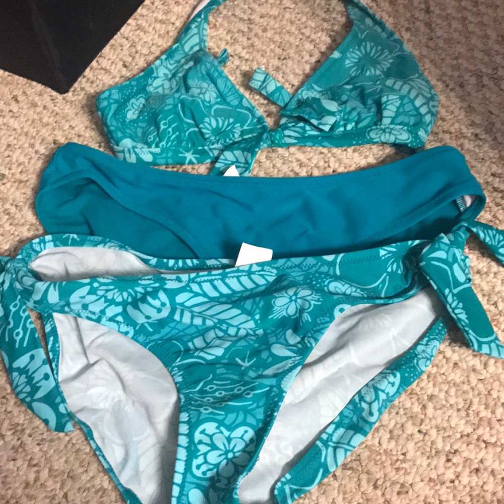 Teal bikini with two bottoms.